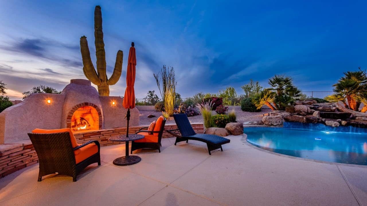 AZ Backyard Picture of a backyard in North Scottsdale with fireplace, swimming pool and patio furniture